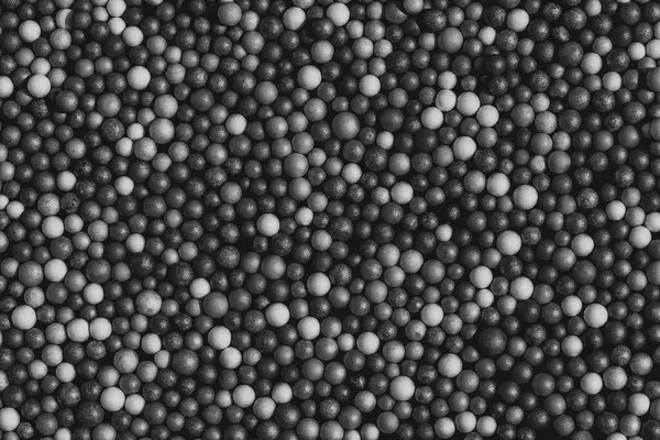 Background of balls. The texture is a lot of different balls. Many  spheres of different sizes.Black and white photo