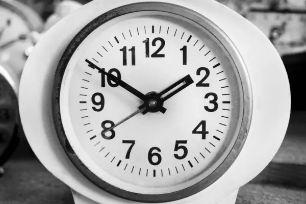 black and white clock, alarm clock,Old Vintage antique clock, Retro styled clock, time concept. Close-up. Black and white classic photo.