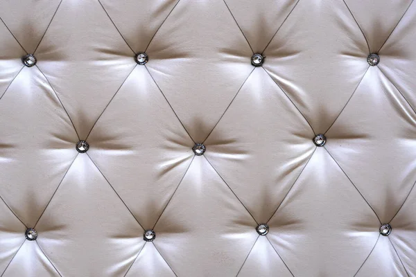 Bright upholstered sofa. Leather Sofa Texture , Gray Leathers Upholstery Pattern. Light background furniture upholstery
