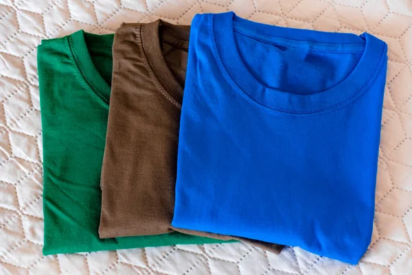 Camisetas Plegadas Diferentes Colores Primer Plano Varias Camisetas Colores Nuevo Imagen De Stock