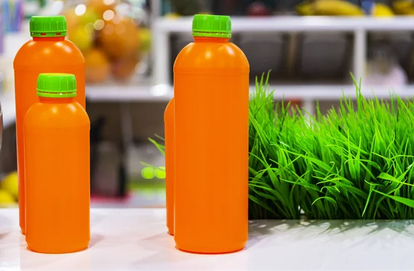 Small bottles with juice. Concept healthy food. healthy eating, drinks, dieting and packaging concept. drinking containers with fruit or vegetable juices. Bottles of freshly  orange and berry juice.