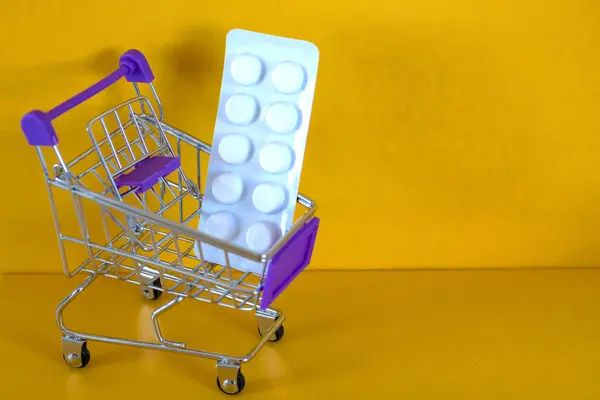 store trolley, Pills, medicines, protective equipment, medical goods. Concept Shortage of medical supplies. Concept Demand, sales growth for medicines and protective equipment.