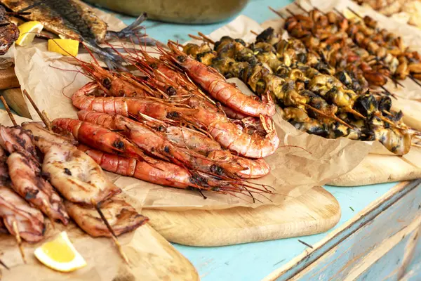 delicious grilled seafood platter. Barbecue seafood with lemon . Sale, exhibition of  shrimps. Close up