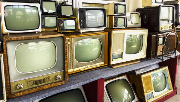Rows of old TVs. The first televisions are tube-type