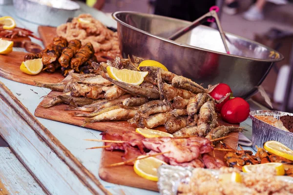 delicious grilled seafood platter. Barbecue  seafood with vegetable. Sale, exhibition of fish and shrimps