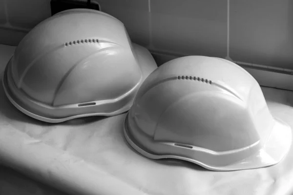 helmets of builders. Concept investors of construction, Builders. Safety at work. Black and white photo