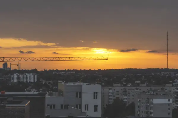 Construction crane. Tower crane and building construction site On sunset.Construction site in sunset
