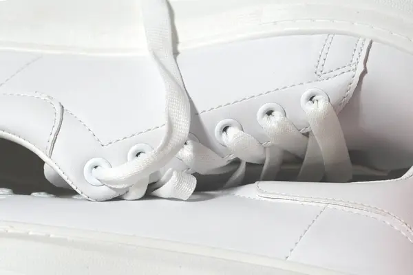 white sneakers background. sport shoes,   Lifestyle sneakers sport shoe. Stylish white sneakers. close-up