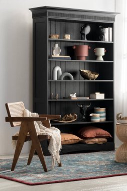 Eclectic style room with rattan, coastal style chair and elegant, black bookcase with different styles decorations