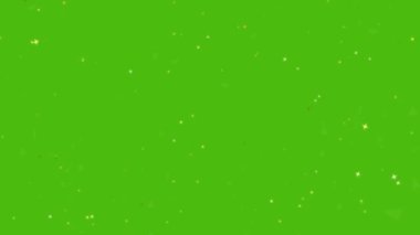 Milyonlarca altın yıldız ve siyah üçmelek yeşil ekran arka planında uçuyor ve soluyor.