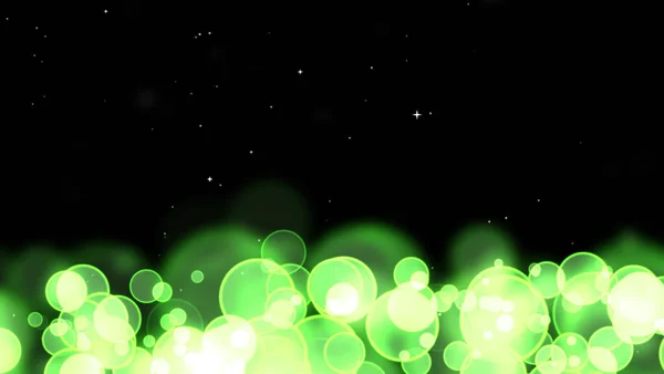 圆形的泡泡在黑色孤立的背景上闪烁着无规律的绿色星光 — 图库照片