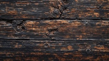 Doğal desenleri ve kusurları barındıran koyu renk ahşap dokusunun yakın plan görüntüsü. Tasarım projeleri, arkaplanlar veya dekoratif kullanım için ideal.