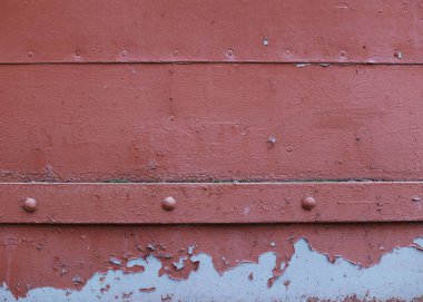 Metal background, old paint texture. Peeled paint from old age. Metal doors