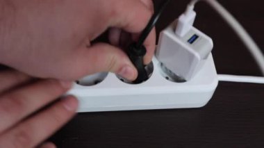 Socket with three connectors for equipment. The carrier is white