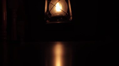 An old kerosene lamp is a light in the dark. There is no electricity