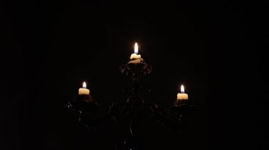 Lighting candles in the dark. When there is no electricity.