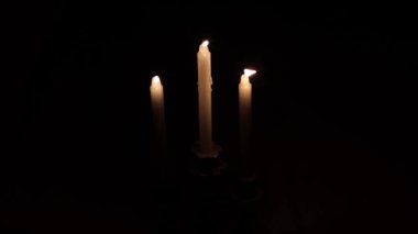 Lighting candles in the dark. When there is no electricity.