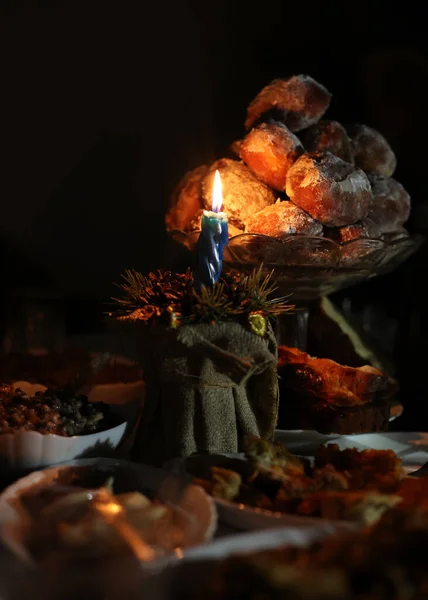 Holy Christmas Eve. Dinner on the table with a candle