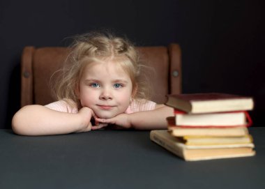 While preparing for school, the child studies at home. Distance learning, homework