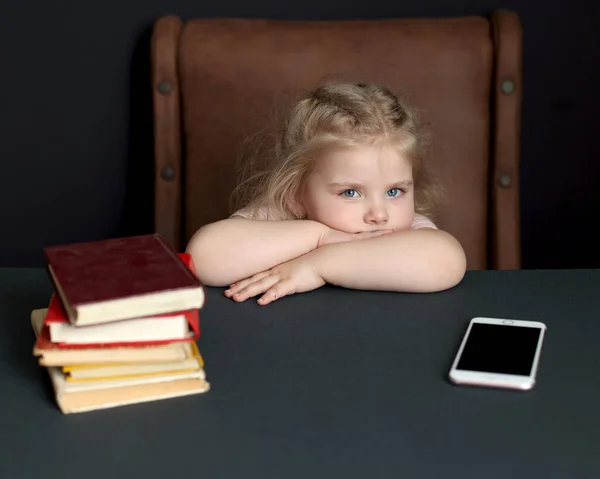 While preparing for school, the child studies at home. Distance learning, homework