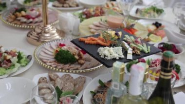 Festive table with delicious dishes. A large selection of dishes, whets the appetite. Wedding in Ukraine