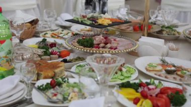 Festive table with delicious dishes. A large selection of dishes, whets the appetite. Wedding in Ukraine