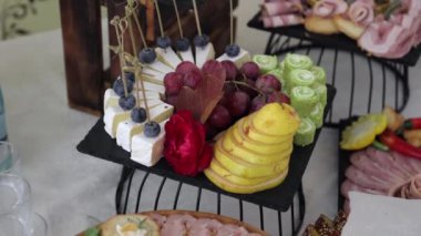 Festive table with delicious snacks. Great selection, whets the appetite. Wedding in Ukraine