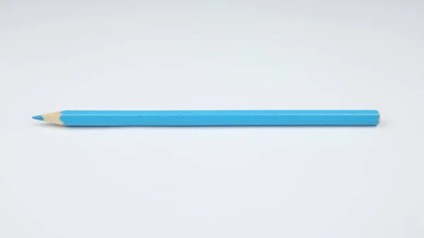 Pencil on a clean white background. Preparation for school. Blue pencil