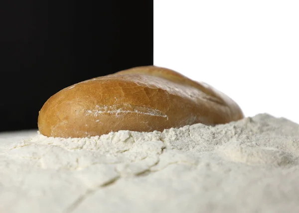 Baking. Baked bread. Bread on flour, a lot of white flour. Loaf with a crispy crust. Fresh breakfast, for sandwiches. Hearty food.