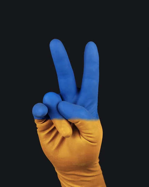 A blue-yellow hand, the color of the Ukrainian flag. Patriot of Ukraine, a free state. Faith in victory