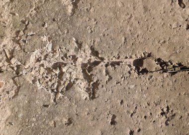 Harap olmuş beton yolun arka planı, gri beton, beton doku, yakın plan. Yüksek kalite fotoğraf. Eski beton levha,