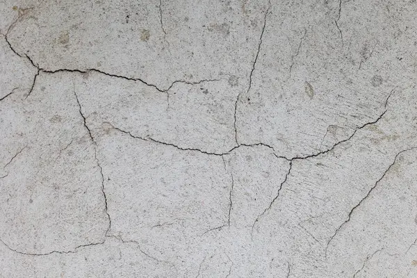 Eski betonun dokuları. Gri hasarlı beton arka plan, duvar, eski döşemeler. Üst görünüm, yakın çekim.