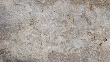 Eski betonun dokuları. Gri hasarlı beton arka plan, eski duvar. Üst görünüm, yakın çekim.