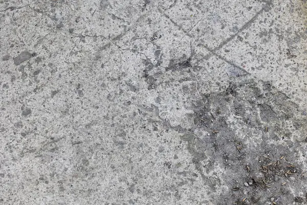 Harap olmuş beton yolun arka planı, gri beton, beton doku, yakın plan. Doğal fotoğraf. Eski beton levha