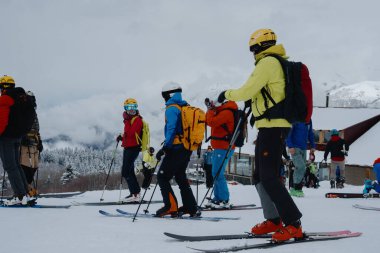 23.03.24 - Hatsvali, Svanetia in Georgia.Skiers and snowboarders at a ski resort. Winter sport. clipart