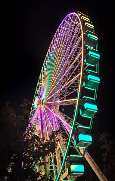 Illuminated ferris wheel in Florence 