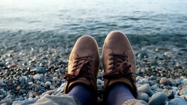 Guy Brown Sneakers Resting Sitting Pebble Sea Beach Throwing Stones — Stock Video