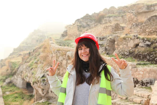 Female archaeologist working on an archaeological site