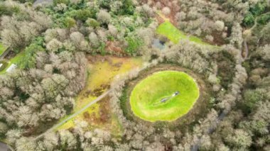 Drone flight over lake and irish sky garden crater. High quality FullHD footage