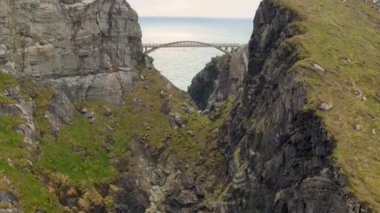 Drone flies towards the Bridge in Mizen Head Ireland . High quality 4k footage