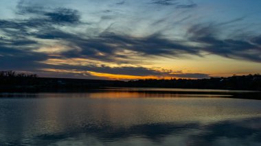 Serene Twilight Over Calm Reflective Waters