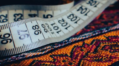 Rolled-up sewing tape with focus on numbers