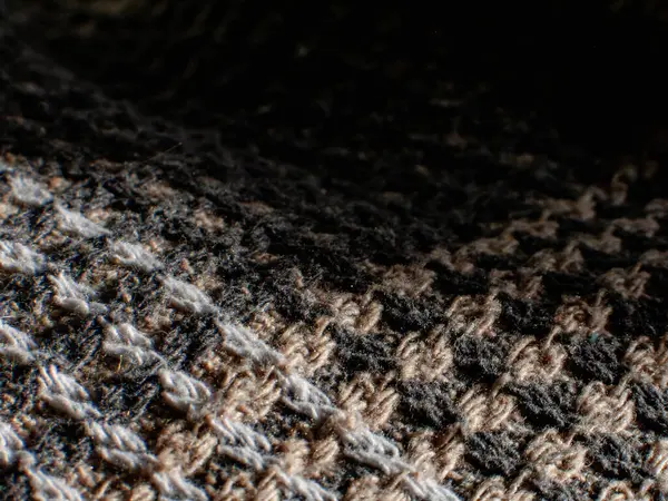 Woven wool fabric with intricate texture details