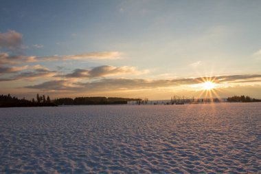 Sunset in winter countryside.