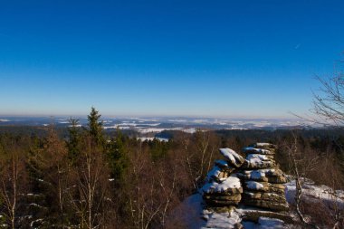 Winter landscape with rock in Czech Republic.
