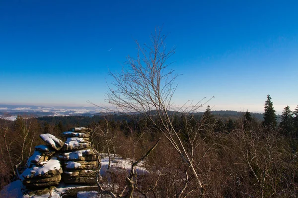 Winter landscape with rock in Czech Republic.
