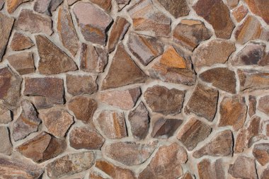 texture of a brick wall from a natural stone