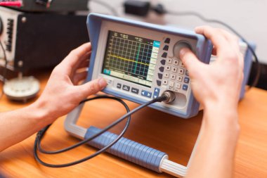 engineers work with electrical measuring devices