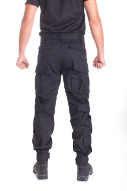 A fighter in military uniform is ready for a fight on a white background