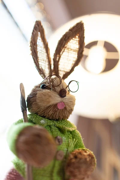 a toy rabbit in glasses as a decoration on the table
